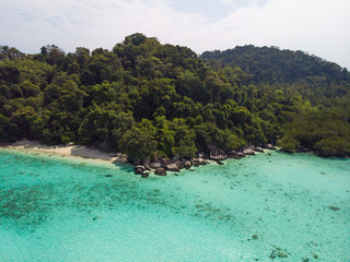 A diving trip in the crystal clear water in front of a lonely island in Southeast Asia