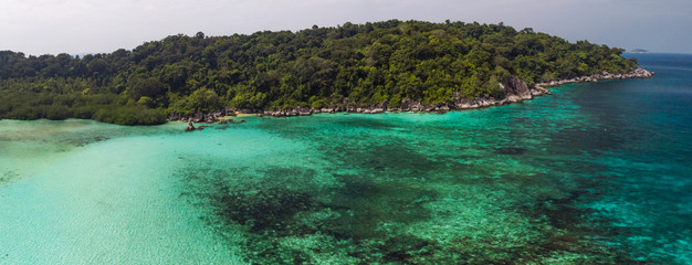 A diving trip in the crystal clear water in front of a lonely island in Southeast Asia