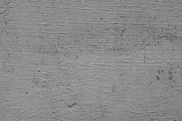 Texture of a concrete wall with cracks and scratches which can be used as a background