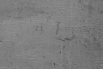 Texture of a concrete wall with cracks and scratches which can be used as a background