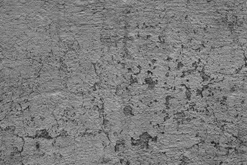 Texture of a concrete wall with cracks and scratches which can be used as a background