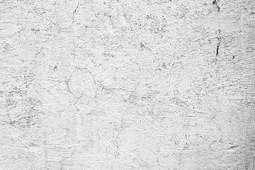 Texture of a concrete wall with cracks and scratches which can be used as a background