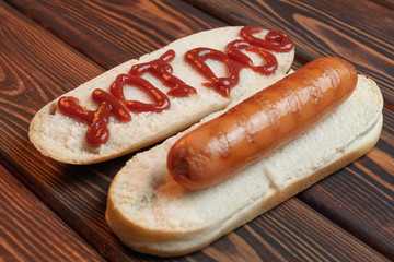 Hot dog on a dark background. Grill-menu