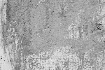 Texture of a concrete wall with cracks and scratches which can be used as a background