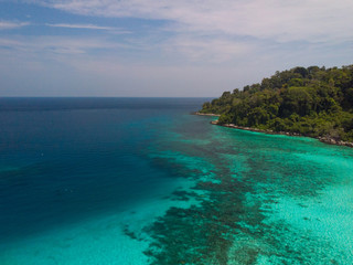 Fototapeta premium A diving trip in the crystal clear water in front of a lonely island in Southeast Asia