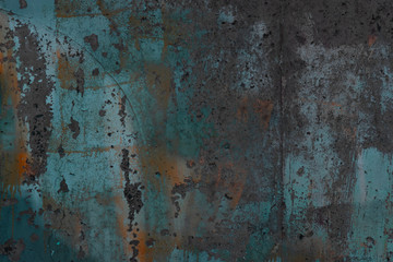 Abstract art texture background. Creative wall art close up. Beautiful dark background. Paint on the wall. Blue, grey, orange and white old cracked concrete wall surface