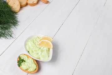 avocado herbs sauce sandwich slices bread crouton restaurant presentation on wooden background