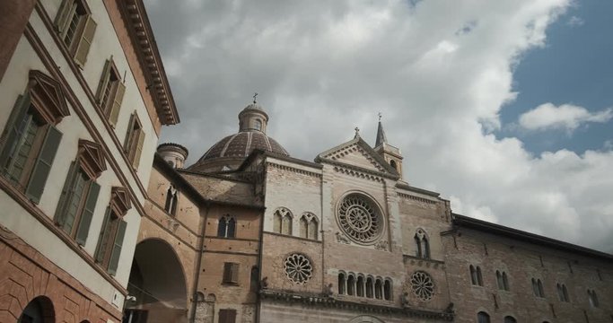 Cathedral of San Feliciano in Foligno with historic buildings. The Romanesque church with stone facades in Piazza della Repubblica.