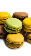 Colored macarons isolated on white background, typical French dish