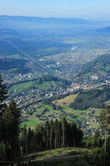 Naklejka premium Stunning view of the Alps valley from the top of the mountain with the Principality of Liechtenstein and the capital Vaduz. Sunny day with the mountains.