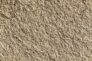 Wall of clay adobe as a background large