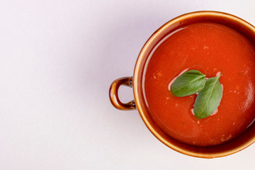 fresh tomato soup in a white bowl