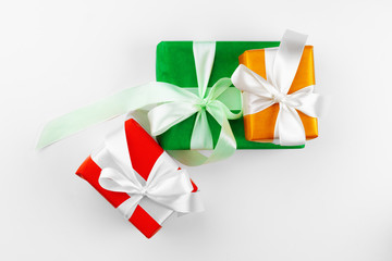 Three beautiful wrapped gifts isolated on white background