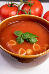 fresh tomato soup in a white bowl