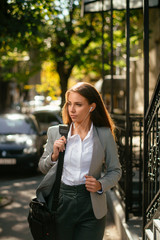 Fototapeta premium Portrait of young woman in the city