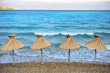 Umbrellas on the beach of Baska resort, Krk island