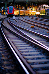Fototapeta premium Train illuminated by the morning sun, morning atmosphere at Aachen Central Station
