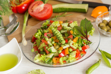 Fresh colorful vegetable salad in plate. Cooking healthy diet food