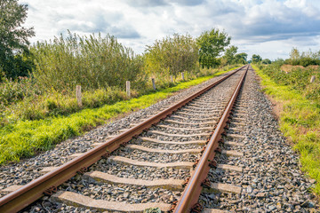 Fototapeta premium Straight single track rails seemingly endless