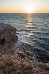 A delightful sunset overlooking the coastline in the Western Crimea. Autumn sea near the Cape Tarkhankut.