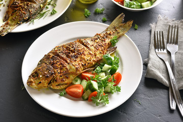 Roasted fish on plate