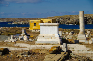 Ancient and historic temple ruins with columns and walls on archeologic site museum island Delos...