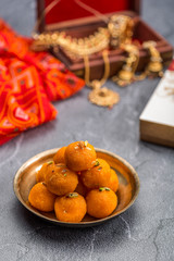 Motichoor Ladoo or Laddu - made from fine bundi, ball shaped sweets popular in indian subcontinent cooked with sugar, ghee or oil