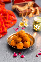 Obraz na płótnie Canvas Motichoor Ladoo or Laddu - made from fine bundi, ball shaped sweets popular in indian subcontinent cooked with sugar, ghee or oil