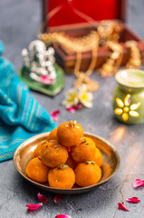 Obraz na płótnie Canvas Motichoor Ladoo or Laddu - made from fine bundi, ball shaped sweets popular in indian subcontinent cooked with sugar, ghee or oil