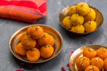 Naklejka na ściany i meble Motichoor Ladoo or Laddu - made from fine bundi, ball shaped sweets popular in indian subcontinent cooked with sugar, ghee or oil
