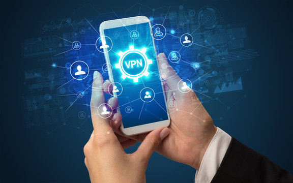 Female hand holding smartphone with VPN abbreviation, modern technology concept