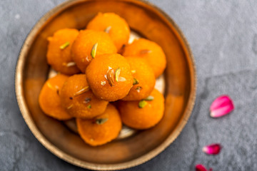 Motichoor Ladoo or Laddu - made from fine bundi, ball shaped sweets popular in indian subcontinent cooked with sugar, ghee or oil