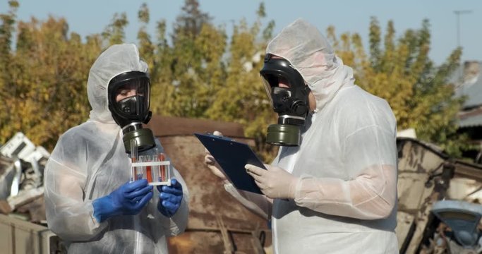 Toxic samples were collected by scientists at waste landfill, landfill, scientists at work, biochemical analysis, chemistry, soil pollution, poisonous habitat, researchers in protective masks