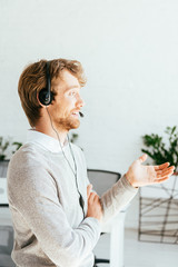 side view of bearded operator gesturing in brokers agency