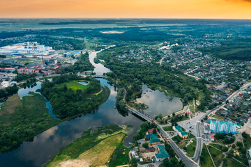 Dobrush, Gomel Region, Belarus. Aerial View Of Dobrush Cityscape Skyline In Spring Sunset Sunrise Time. Residential District And River In Bird's-eye View