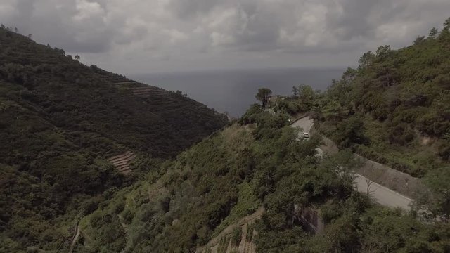 Aerial shot Top View of the mountains and street near the italien village monterosso