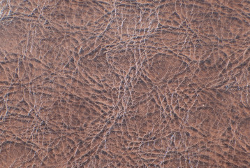 Elegant brown leatherette background. Free space for text.