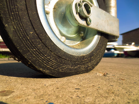 Small Wheel With A Rubber Tire. The Front Wheel Of The Trailer For Transporting The Boat