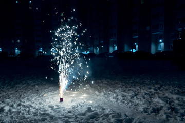 Burning Mini Fireworks in the Snow on a Winter Evening