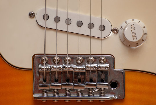 the location of the strings of the electric guitar relative to the pickup