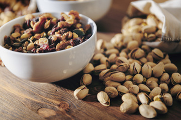 white bowl with mixed nuts and pistachios