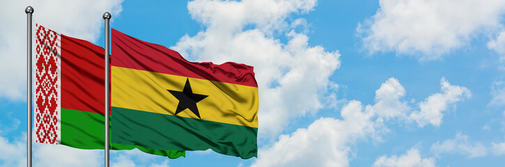Belarus and Ghana flag waving in the wind against white cloudy blue sky together. Diplomacy concept, international relations.