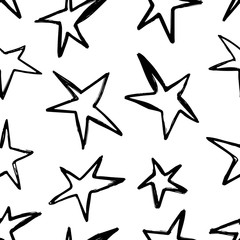 Grunge hand drawn stars seamless pattern. Repetetive pattern in black and white. Perfect for wrapping paper, textile, fabric and backdrops. Vector.