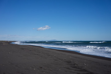Seascape with volcanic beach on the Kamchatka Peninsula.