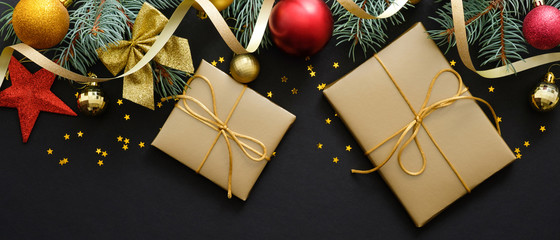 christmas gifts box on black background with holiday decorartion