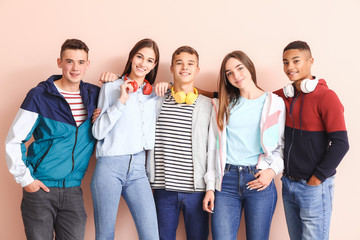 Portrait of teenagers on color background