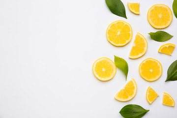 Ripe cut lemons on white background