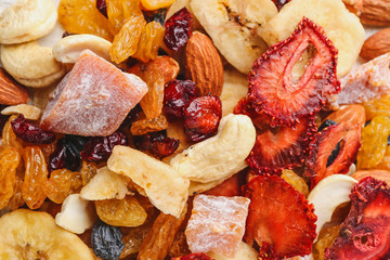 Different dried fruits and nuts as background