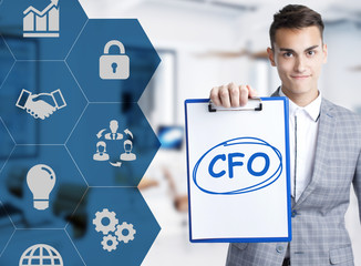 Business, technology, internet and network concept. Young businessman shows a keyword: CFO