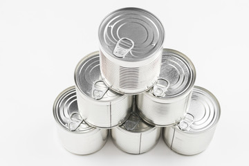 Group of silver canned food on white background.